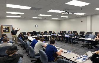 Class of students sitting at table during the CVCC Construction Careers Academy