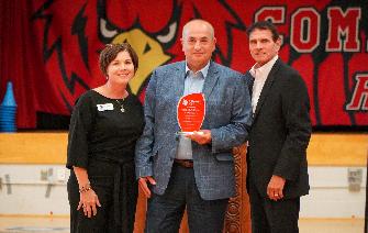 Christy Lefevers, Peter Rumswinkel, Gary Muller stand at CAN ceremony